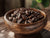 Medium Roast Coffee Beans in a Wooden Bowl on a Breakfast Table